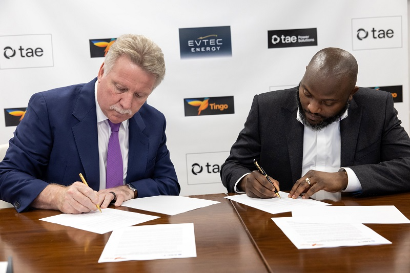 Dozy Mmobuosi of Tingo Mobile sigining a partnership